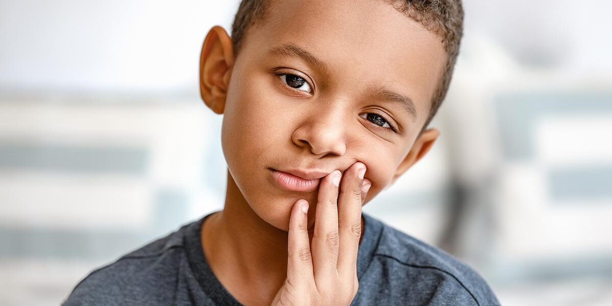 A child with pain in the mouth