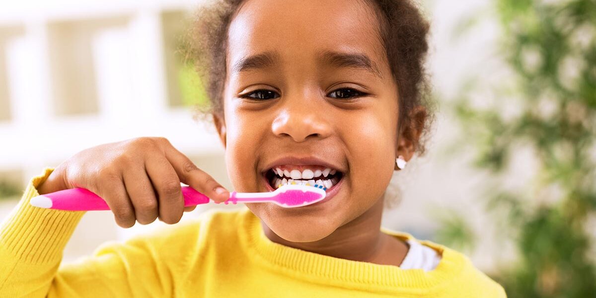 A girl brushing her teeth