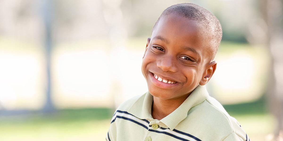 Happy Young African American By in the Park.